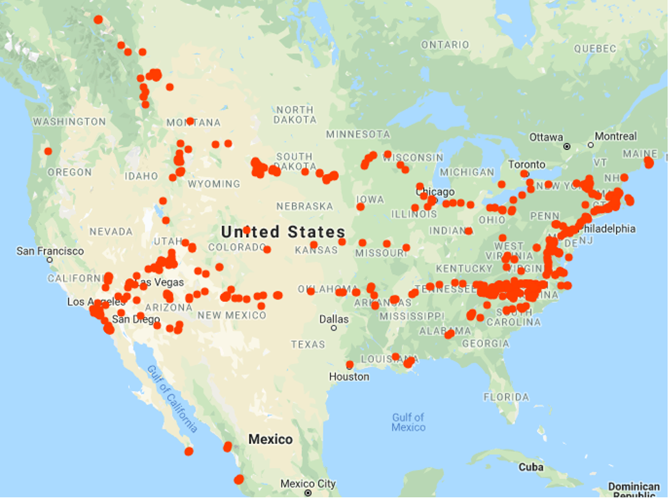 A map of US and Canada with many red dots indicating places George has traveled. Nearly every state has at least one dot.